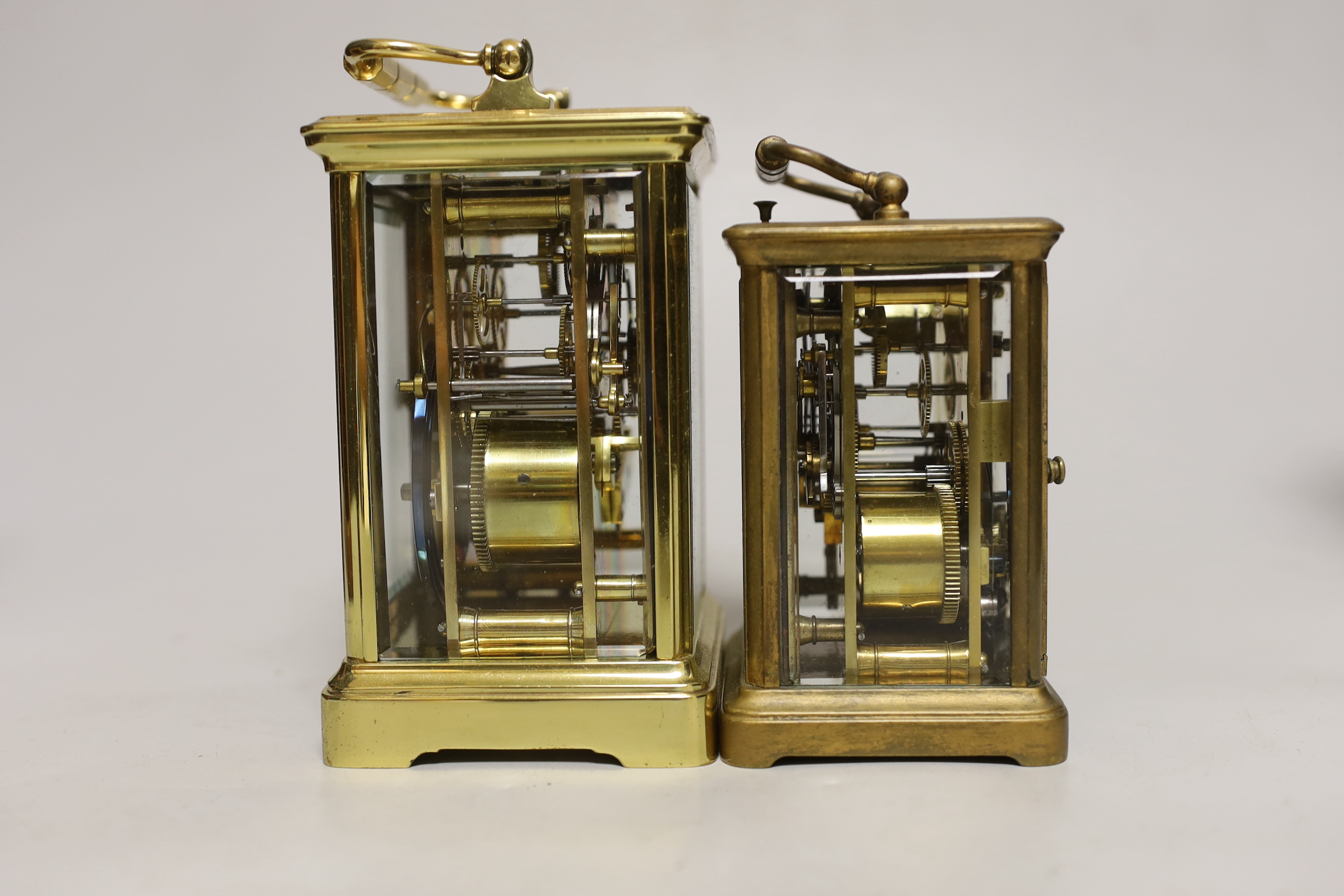 Two cased brass carriage cased clocks, one a repeating carriage clock, tallest 15cm high